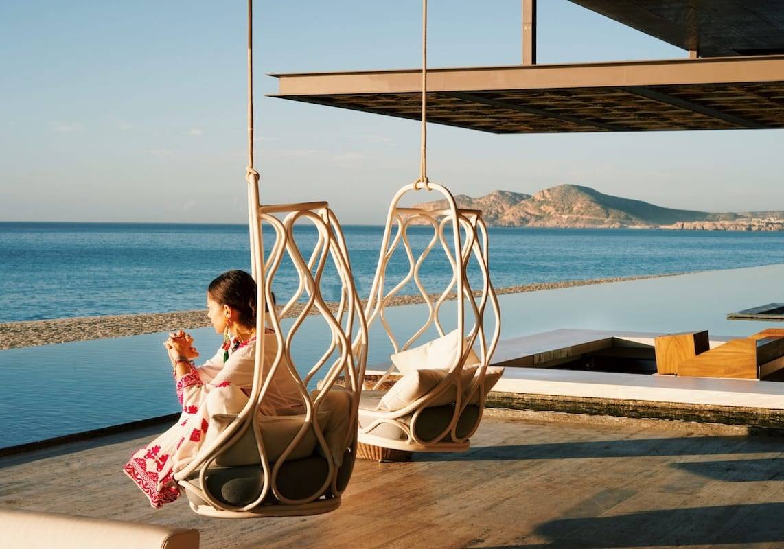 Woman sitting outside private residence