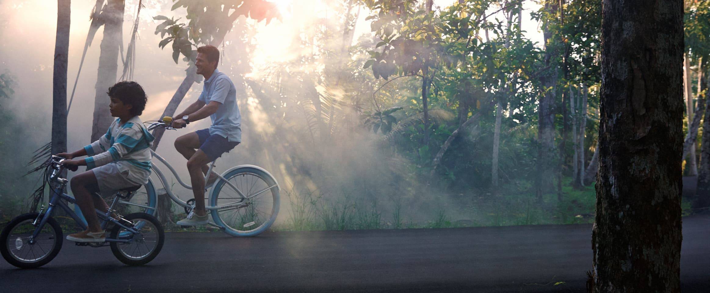 Father and son riding bikes